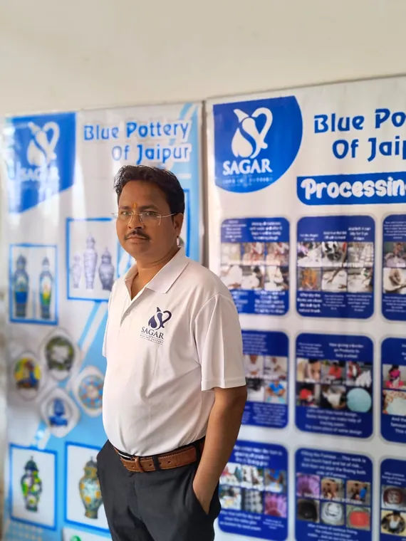 Explaining the blue pottery process to visiting groups.